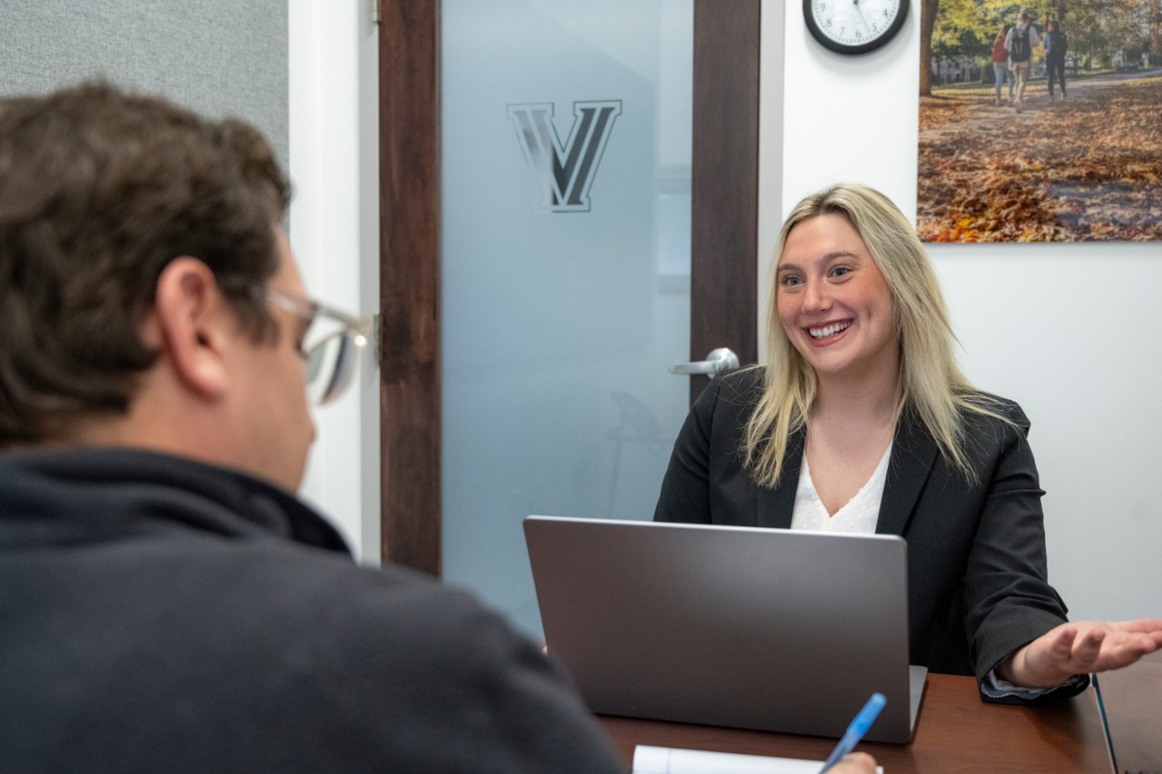 A student speaking with an employer.